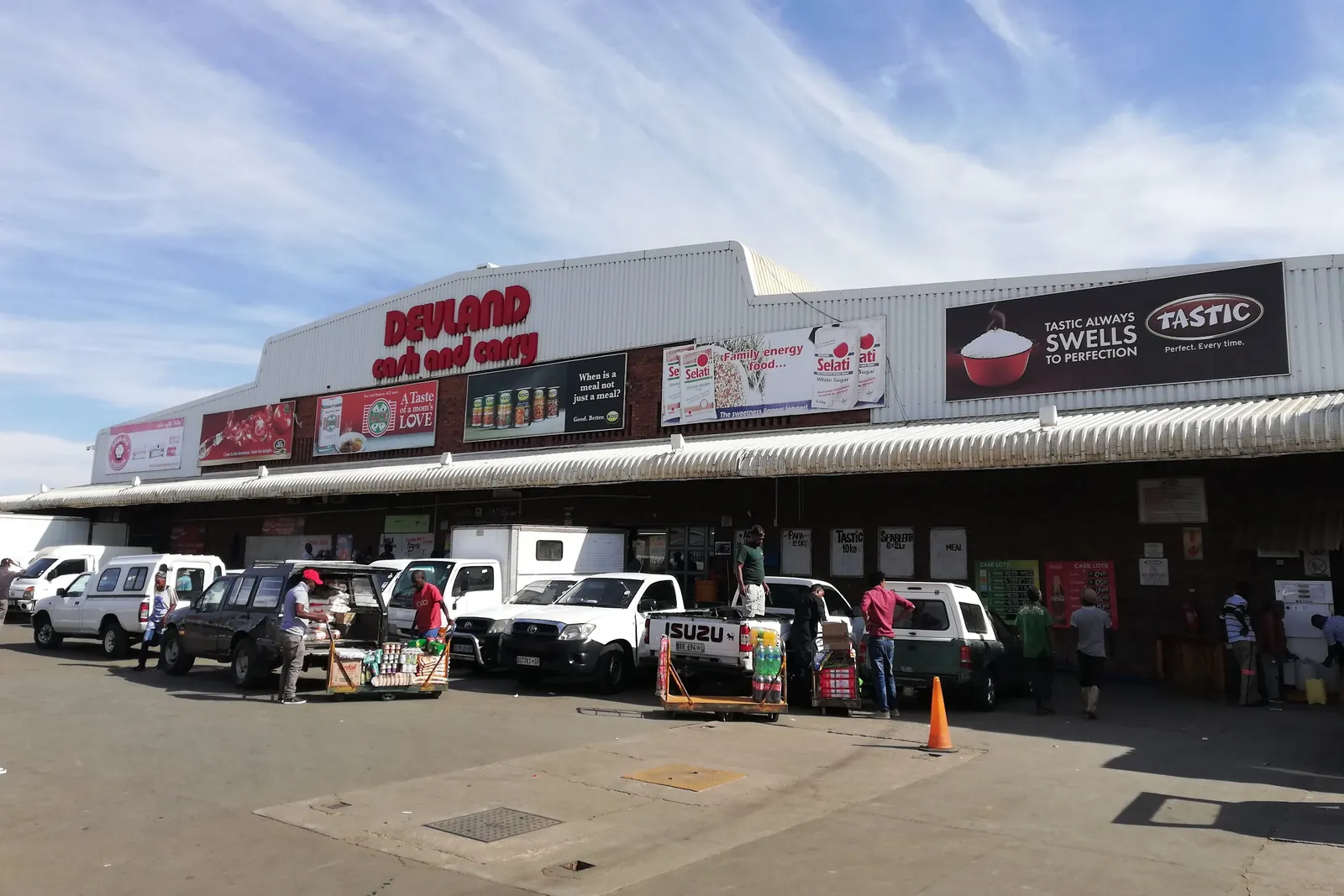Traders loading stock outside the Devland Cash & Carry head office in Soweto